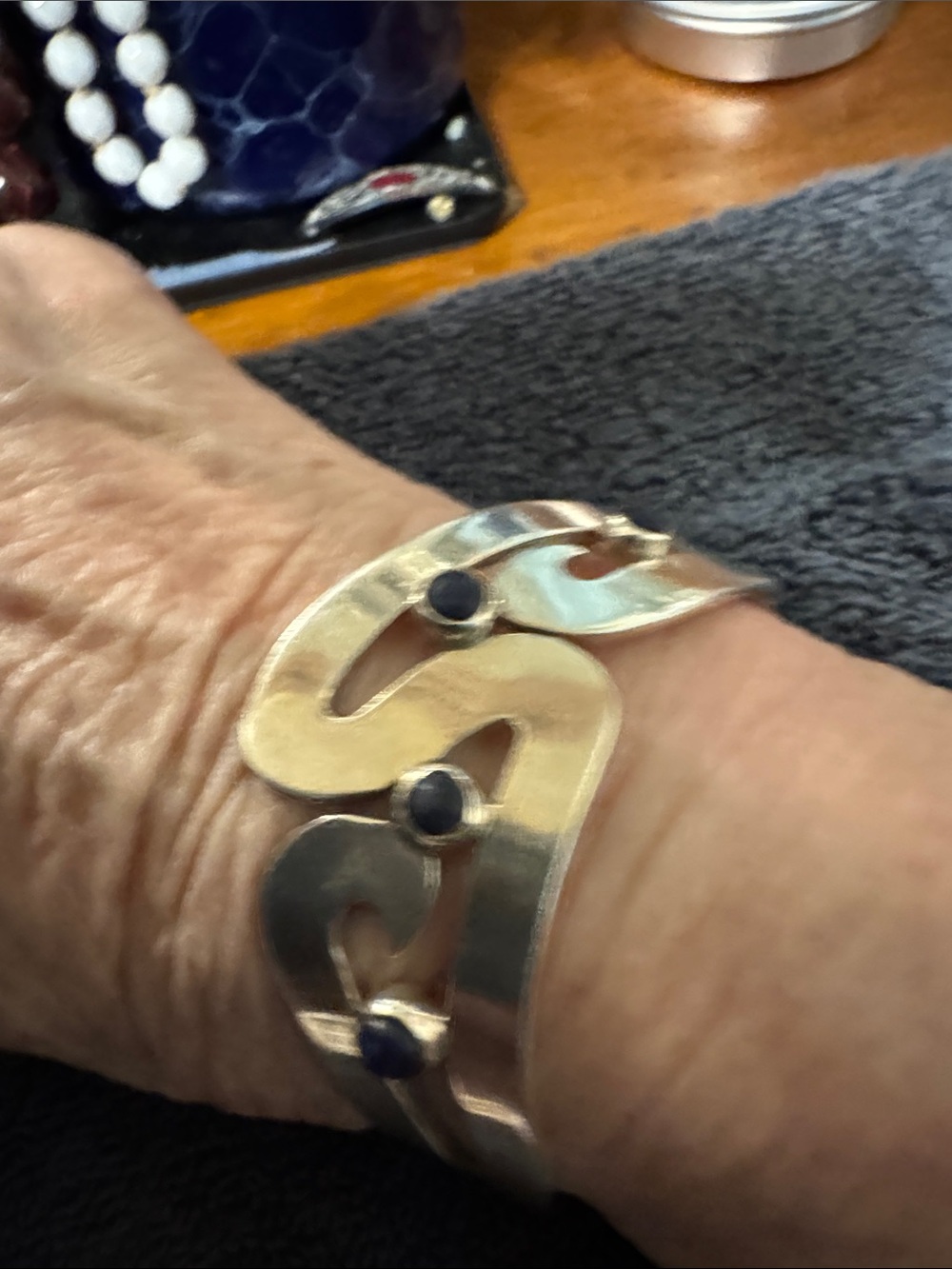 Sterling Silver Open Wave Bracelet with Blue Stone Accents